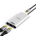 mbeat MB-DLA-CD2H USB-C to dual HDMI DisplayLink adapter with two HDMI cables connected to output ports and USB-C host cable shown disconnected, on white background.
